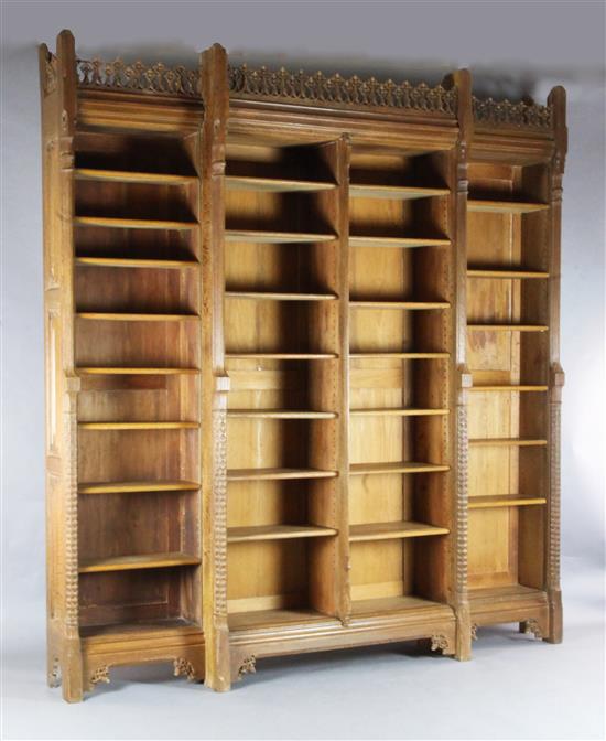 Attributed to A.W.N. Pugin. A mid 19th century Reformed Gothic oak breakfront open bookcase, probably made by J.G.Crace, W.7ft 10in.